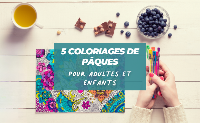 Table avec une feuille de coloriage, des crayons de couleurs, du chocolat noisette, une tasse de thé et des myrtilles