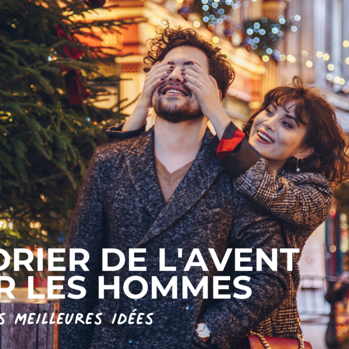 femme qui cachent les yeux d'un homme dans une rue décorée pour Noel